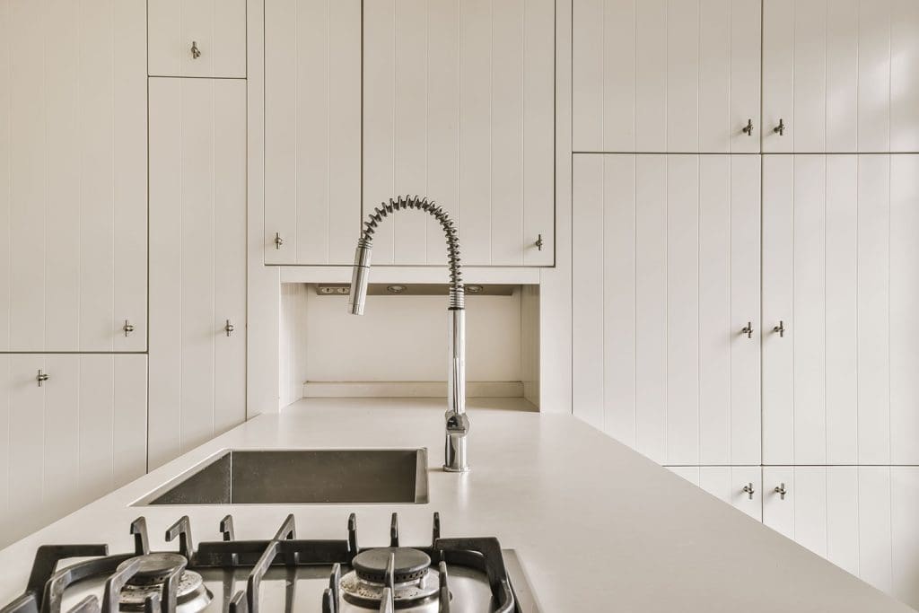Spotless clean white kitchen in a newly built home completed during a builders clean by AYN Services in Townsville.